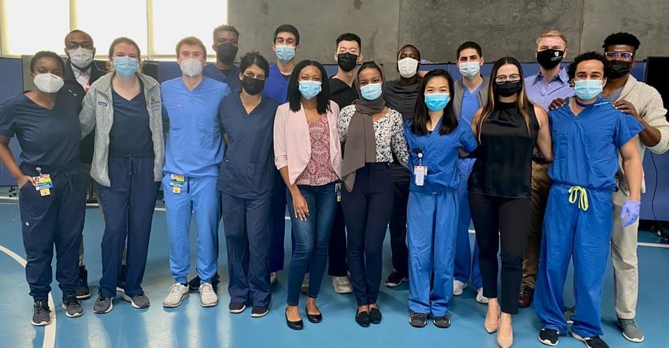 Masked students in scrubs